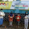 Sosialisasikan Prokes dengan Berbagi Ratusan Box Nasi Kuning